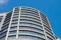 Office skyscraper high business building on blue sky background, looking up to glass modern building Royalty Free Stock Photo