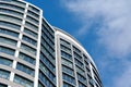 Office skyscraper high business building on blue sky background, looking up to glass modern building Royalty Free Stock Photo