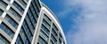 Office skyscraper high business building on blue sky background, looking up to glass modern building Royalty Free Stock Photo