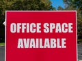 Office Space Available large sign near vacant building advertising the real estate, property, office for sale, rent or lease Royalty Free Stock Photo