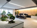 Office space with Zen garden feature desks and bright lighting visible Royalty Free Stock Photo