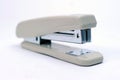 Office stationary Gray stapler with pile of staples Royalty Free Stock Photo