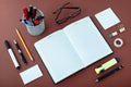 Office Supplies Arranged Around Notebook on Desk Royalty Free Stock Photo