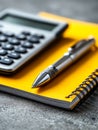 Office supplies with calculator, pen, and notebook on a textured surface Royalty Free Stock Photo