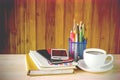 Office supplies and coffee on wooden table Royalty Free Stock Photo
