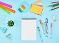 Office supplies, stationery on blue office desktop. Top view of modern bright table with notebook. Mock up, copy space Royalty Free Stock Photo