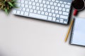 Office supplies are tablet, pen, computer, notebook, mobile phone and red coffee mug placed at an office desk. Royalty Free Stock Photo