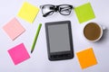 Office table with accessories: a tablet, glasses, pen, paper. Royalty Free Stock Photo