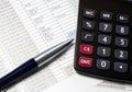 Office table with calculator, pen and accounting document Royalty Free Stock Photo