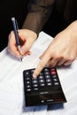 Office table with calculator, pen and accounting document Royalty Free Stock Photo