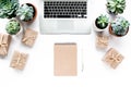 Office table desk. laptop, computer, camera, succulent. Flat composition, magazines, social media and artists. Top view