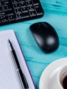 Office table desk. Workspace with note book, keyboard, office supplies and coffee cup on wooden background. Royalty Free Stock Photo