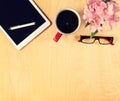 Office table with digital tablet, reading glasses and cup of coffee. View from above Royalty Free Stock Photo