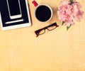 Office table with digital tablet, smartphone, reading glasses and cup of coffee. View from above Royalty Free Stock Photo