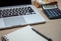 Office table with laptop notebook and cash stack Royalty Free Stock Photo