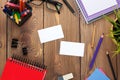 Office table with notepad, colorful pencils, supplies and business cards
