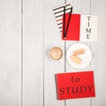 Office table with notepads and inscription & x22;TIME to STUDY& x22;, cup of coffee and waffles Royalty Free Stock Photo