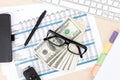 Office table with pc, supplies and money cash Royalty Free Stock Photo