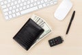 Office table with pc, supplies and money cash Royalty Free Stock Photo