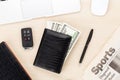 Office table with pc, supplies, newspaper and money cash Royalty Free Stock Photo