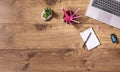 Office table top view with laptop, pencils and notepad. Workplace view from above on wooden desk. Copy space on wodden background Royalty Free Stock Photo