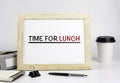 Office table with wooden frame with text - Time for lunch