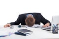 Exhausted businessman falling asleep at his office desk Royalty Free Stock Photo