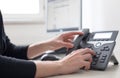 Classical black telephone in the office, customer support and telesale Royalty Free Stock Photo