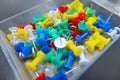 Thumb pins rainbow of colors in transparent box Royalty Free Stock Photo