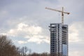 Office tower under construction with big crane on site Royalty Free Stock Photo