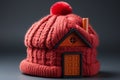 Office warmth represented by close-up insulation symbol house with red bonnet Royalty Free Stock Photo