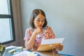 Office woman reading financial document next to the window Royalty Free Stock Photo