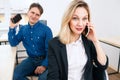 Office woman retelling gossip by phone