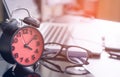 Office work desk with clock showing 4pm to finish work Royalty Free Stock Photo