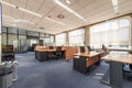 Office with work desks in rows and office fish tanks in the background