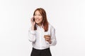 Office work, people and business concept. Portrait of cute asian girl drinking coffee and talking on phone with pleased Royalty Free Stock Photo