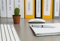 Office work space on grey desk with cactus and Royalty Free Stock Photo