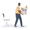 Office worker with a box of stationery in the hands. Sad young black man holding office supplies. Concept: employee was fired Royalty Free Stock Photo