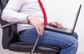 Office worker businessman with a laptop sitting on an office chair with a thick retractable stomach, bowel problems gas flatulence Royalty Free Stock Photo