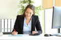 Office worker calculating using calculator Royalty Free Stock Photo