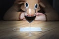 Office worker in cosplay costume of a cow. Guy in the funny animal pyjamas near the a glass of wine. Alcoholic addict, Lost job,