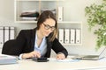 Office worker doing accounting on a desk