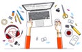 Office worker or entrepreneur working on a laptop computer, top view of workspace desk with human hands and diverse stationery Royalty Free Stock Photo