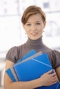 Office worker holding folders Royalty Free Stock Photo