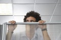 Office Worker Peering Over Cubicle Wall