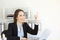 Office worker pointing up to a blank space