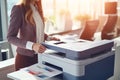 Office worker print paper on multifunction laser printer. Document and paperwork. Secretary work. Woman working in business office