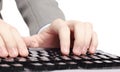 Office worker prints on the black keyboard Royalty Free Stock Photo