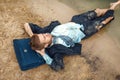 Office worker resting on the beach, desert island