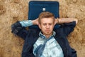 Office worker resting on the beach, desert island